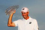 PONTE VEDRA BEACH, FL - MAY 13:  Matt Kuchar of the United States celebrates with the trophy after his two-stroke victory during the final round to win THE PLAYERS Championship held at THE PLAYERS Stadium course at TPC Sawgrass on May 13, 2012 in Ponte Vedra Beach, Florida.  (Photo by Sam Greenwood/Getty Images)