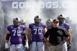 FORT WORTH, TX - OCTOBER 16:  Head coach Gary Patterson of the TCU Horned Frogs takes to the field with offensive guard Josh Vernon #78 and tackle Zach Roth #70 against the BYU Cougars at Amon G. Carter Stadium on October 16, 2010 in Fort Worth, Texas.  (Photo by Tom Pennington/Getty Images)