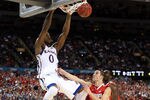 NEW ORLEANS, LA - MARCH 31:  Thomas Robinson #0 of the Kansas Jayhawks dunks the ball against Aaron Craft #4 of the Ohio State Buckeyes in the second half during the National Semifinal game of the 2012 NCAA Division I Men's Basketball Championship at the Mercedes-Benz Superdome on March 31, 2012 in New Orleans, Louisiana.  (Photo by Jeff Gross/Getty Images)