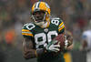 GREEN BAY, WI - JANUARY 01:  Donald Driver #80 of the Green Bay Packers reacts as he scores a touchdown against the Detroit Lions at Lambeau Field on January 1, 2012 in Green Bay, Wisconsin. The Packers defeated the Lions 45-41.  (Photo by Jonathan Daniel/Getty Images)