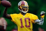 ASHBURN, VA - MAY 06:  Robert Griffin III #10 of the Washington Redskins practices during the Washington Redskins rookie minicamp on May 6, 2012 in Ashburn, Virginia.  (Photo by Patrick McDermott/Getty Images)
