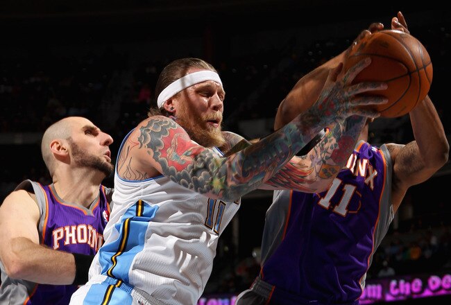 DENVER, CO - FEBRUARY 14:  Chris Andersen #11 of the Denver Nuggets grabs a rebound away from Markieff Morris #11 and Marcin Gortat #4 of the Phoenix Suns at the Pepsi Center on February 14, 2012 in Denver, Colorado. NOTE TO USER: User expressly acknowledges and agrees that, by downloading and or using this Photograph, user is consenting to the terms and conditions of the Getty Images License Agreement.  (Photo by Doug Pensinger/Getty Images)