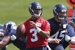RENTON, WA - MAY 11:  Quarterback Russell Wilson #3 of the Seattle Seahawks looks to pass during minicamp at the Virginia Mason Athletic Center on May 11, 2012 in Renton, Washington. (Photo by Otto Greule Jr/Getty Images)
