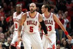 CHICAGO, IL - MAY 15:  (L-R) Luol Deng #9, Carlos Boozer #5 and Joakim Noah #13 of the Chicago Bulls get back on defense against the Miami Heat in Game One of the Eastern Conference Finals during the 2011 NBA Playoffs on May 15, 2011 at the United Center in Chicago, Illinois. NOTE TO USER: User expressly acknowledges and agrees that, by downloading and or using this photograph, User is consenting to the terms and conditions of the Getty Images License Agreement  (Photo by Gregory Shamus/Getty Images)