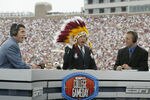 TALLAHASSEE, FL - OCTOBER 26:  ESPN College GameDay announcer Lee Corso dons an FSU headress as co-announcers (l to r) Chris Fowler and Kirk Herbstreit comment during the NCAA football game between Notre Dame and Florida State at Doak Campbell Stadium on October 26, 2002 in Tallahassee, Florida.  The Notre Dame Fighting Irish defeated the Florida State Seminoles 34-24.  (Photo by Craig Jones/Getty Images)
