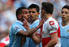 MANCHESTER, ENGLAND - MAY 13:  Carlos Tevez of Manchester City clashes with Joey Barton of QPR after being fouled during the Barclays Premier League match between Manchester City and Queens Park Rangers at the Etihad Stadium on May 13, 2012 in Manchester, England.  (Photo by Alex Livesey/Getty Images)