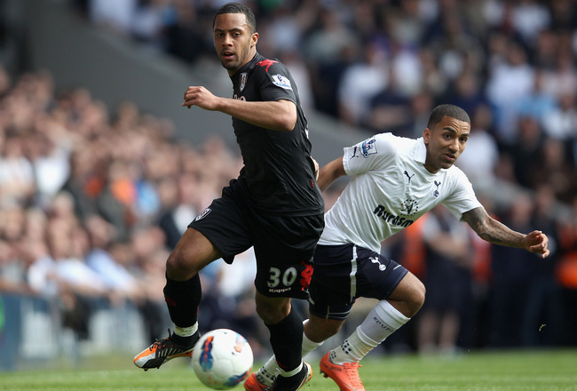 LONDON, ENGLAND - MAY 13:  Moussa Dembele of Fulham and Aaron Lennon of Tottenham Hotspur tussle for the ball during the Barclays Premier League match between Tottenham Hotspur and Fulham at White Hart Lane on May 13, 2012 in London, England.  (Photo by Clive Rose/Getty Images)