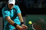ROME, ITALY - MAY 14:  John Isner of the USA plays a backhand against Philipp Kohlschreiber of Germany  in their first round match during day three of the Internazionali BNL d'Italia 2012  at the Foro Italico Tennis Centre on May 14, 2012 in Rome, Italy.  (Photo by Clive Brunskill/Getty Images)