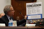 WASHINGTON - SEPTEMBER 23:  Stanley Herring, chairman of the Subcommittee on Education and Advocacy, Head, Neck and Spine Committee of the NFL and team physician for the Seattle Seahawks and Seattle Mariners, holds up a Centers for Disease Control poster about concussions while testifying before the House Education and Labor Committee about the Protecting Student Athletes from Concussions Act on Capitol Hill September 23, 2010 in Washington, DC. Herring testified about the NFL's work to reduce, identify and treat concussions and subconcussive injuries.  (Photo by Chip Somodevilla/Getty Images)