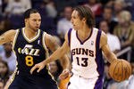 PHOENIX - OCTOBER 12:  Steve Nash #13 of the Phoenix Suns looks to pass the ball during the preseason NBA game against the Utah Jazz at US Airways Center on October 12, 2010 in Phoenix, Arizona. NOTE TO USER: User expressly acknowledges and agrees that, by downloading and or using this photograph, User is consenting to the terms and conditions of the Getty Images License Agreement.  (Photo by Christian Petersen/Getty Images)