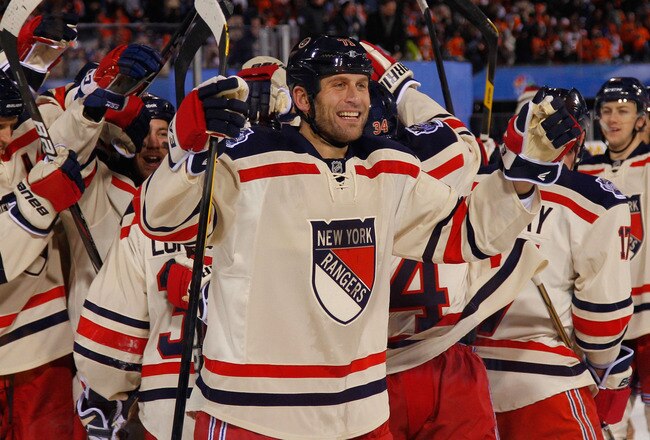 PHILADELPHIA, PA - JANUARY 02:  Mike Rupp #71 and the New York Rangers celebrate after defeating the Philadelphia Flyers by a score of 3-2 during the 2012 Bridgestone NHL Winter Classic at Citizens Bank Park on January 2, 2012 in Philadelphia, Pennsylvania.  (Photo by Rob Carr/Getty Images)