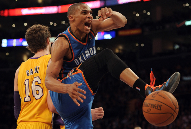 LOS ANGELES, CA - MARCH 29:  Russell Westbrook #0 of the Oklahoma City Thunder reacts after his dunk in front of Pau Gasol #16 of the Los Angeles Lakers during a 102-93 win over the Los Angeles Lakers at Staples Center on March 29, 2012 in Los Angeles, California.  NOTE TO USER: User expressly acknowledges and agrees that, by downloading and or using this photograph, User is consenting to the terms and conditions of the Getty Images License Agreement.  (Photo by Harry How/Getty Images)