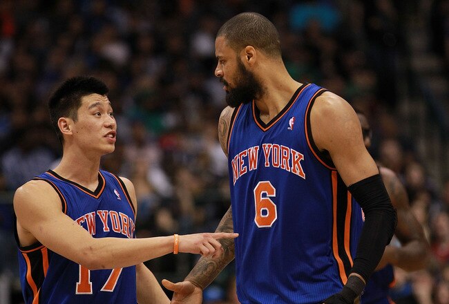 DALLAS, TX - MARCH 06:  Jeremy Lin #17 of the New York Knicks talks with Tyson Chandler during play against the Dallas Mavericks at American Airlines Center on March 6, 2012 in Dallas, Texas.  NOTE TO USER: User expressly acknowledges and agrees that, by downloading and or using this photograph, User is consenting to the terms and conditions of the Getty Images License Agreement.  (Photo by Ronald Martinez/Getty Images)