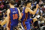 WASHINGTON, DC - FEBRUARY 08:  Jeremy Lin #17 of the New York Knicks and Steve Novak #16 celebrate during a timeout against the Washington Wizards during the second half at Verizon Center on February 8, 2012 in Washington, DC. NOTE TO USER: User expressly acknowledges and agrees that, by downloading and or using this photograph, User is consenting to the terms and conditions of the Getty Images License Agreement.  (Photo by Rob Carr/Getty Images)