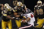 NEW ORLEANS, LA - SEPTEMBER 25:   Ben Tate #44 of the Houston Texans is tackled by  Will Smith #91 of the New Orleans Saints at the Louisiana Superdome on September 25, 2011 in New Orleans, Louisiana.  The Saints defeated the Texans 40-33.  (Photo by Chris Graythen/Getty Images)