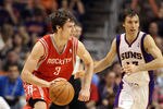 PHOENIX, AZ - FEBRUARY 09:  Goran Dragic #3 of the Houston Rockets drives the ball past Steve Nash #13 of the Phoenix Suns during the NBA game at US Airways Center on February 9, 2012 in Phoenix, Arizona. The Rockets defeated the Suns 96-89. NOTE TO USER: User expressly acknowledges and agrees that, by downloading and or using this photograph, User is consenting to the terms and conditions of the Getty Images License Agreement.  (Photo by Christian Petersen/Getty Images)