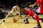 SAN ANTONIO, TX - MAY 15:  Manu Ginobili #20 of the San Antonio Spurs and Eric Bledsoe #12 of the Los Angeles Clippers battle for a loose ball in Game One of the Western Conference Semifinals in the 2012 NBA Playoffs at AT&T Center on May 15, 2012 in San Antonio, Texas. The Spurs defeated the Clippers 108-92. NOTE TO USER: User expressly acknowledges and agrees that, by downloading and or using this photograph, User is consenting to the terms and conditions of the Getty Images License Agreement.  (Photo by Justin Edmonds/Getty Images)