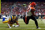 ST. LOUIS, MO - DECEMBER 18: Cedric Benson #32 of the Cincinnati Bengals scores a touchdown against Josh Gordy #38 of the St. Louis Rams at the Edward Jones Dome on December 18, 2011 in St. Louis, Missouri.  The Bengals beat the Rams 20-13.  (Photo by Dilip Vishwanat/Getty Images)