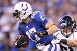INDIANAPOLIS, IN - NOVEMBER 13:  Austin Collie #17 of the Indianapolis Colts runs with the ball while defended by Paul Posluszny #51 of the Jacksonville Jaguars at Lucas Oil Stadium on November 13, 2011 in Indianapolis, Indiana. The Jaguars won 17-3.  (Photo by Andy Lyons/Getty Images)