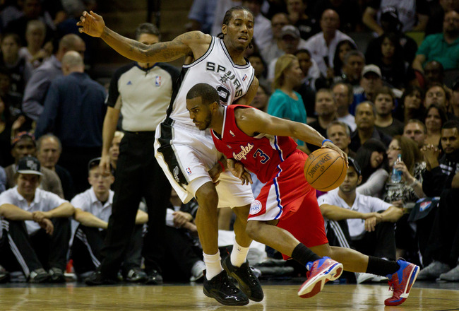 SAN ANTONIO, TX - MAY 15:  Chris Paul #3 of the Los Angeles Clippers drives on Kawhi Leonard #2 of the San Antonio Spurs in Game One of the Western Conference Semifinals in the 2012 NBA Playoffs at AT&T Center on May 15, 2012 in San Antonio, Texas. The Spurs defeated the Clippers 108-92. NOTE TO USER: User expressly acknowledges and agrees that, by downloading and or using this photograph, User is consenting to the terms and conditions of the Getty Images License Agreement.  (Photo by Justin Edmonds/Getty Images)