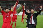 ISTANBUL, TURKEY - MAY 25:  Liverpool captain Steven Gerrard and Liverpool manager Rafael Benitez of Spain lift the European Cup after Liverpool won the European Champions League final between Liverpool and AC Milan on May 25, 2005 at the Ataturk Olympic Stadium in Istanbul, Turkey.  (Photo by Mike Hewitt/Getty Images)