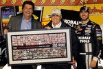 DARLINGTON, SC - MAY 12:  (R-L) Jimmie Johnson, driver of the #48 Lowe's/Kobalt Tools Chevrolet, celebrates in Victory Lane with team owner Rick Hendrick and NASCAR President Mike Helton after winning the NASCAR Sprint Cup Series Bojangles' Southern 500 at Darlington Raceway on May 12, 2012 in Darlington, South Carolina. This is the 200th win for Hendrick Motorsports.  (Photo by Todd Warshaw/Getty Images)