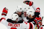 NEW YORK, NY - MAY 16:  The New Jersey Devils celebrate a third period goal by David Clarkson #23 (not pictured) in Game Two of the Eastern Conference Final against the New York Rangers during the 2012 NHL Stanley Cup Playoffs at Madison Square Garden on May 16, 2012 in New York City.  (Photo by Paul Bereswill/Getty Images)