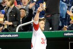 WASHINGTON, DC - MAY 14:  Bryce Harper #34 of the Washington Nationals waves to the crowd after hitting his first career home run in the third inning against the San Diego Padres at Nationals Park on May 14, 2012 in Washington, DC.  (Photo by Greg Fiume/Getty Images)