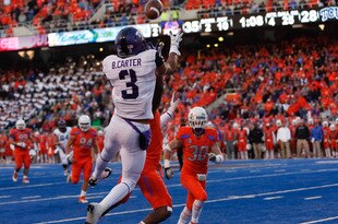 BOISE, ID - NOVEMBER 12:  Brandon Carter #3 of the TCU Horned Frogs makes a catch for a touchdown against the Boise State Broncos at Bronco Stadium on November 12, 2011 in Boise, Idaho.  (Photo by Otto Kitsinger III/Getty Images)