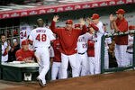 ANAHEIM, CA - OCTOBER 22:  Torii Hunter #48 of the Los Angeles Angels of Anaheim celebrates with batting coach Mickey Hatcher after scoring in the seventh inning in Game Five of the ALCS against the New York Yankees during the 2009 MLB Playoffs at Angel Stadium on October 22, 2009 in Anaheim, California.  (Photo by Harry How/Getty Images)