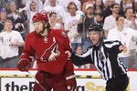 GLENDALE, AZ - MAY 15:  Linesman Brian Murphy #93 gets hold of Martin Hanzal #11 of the Phoenix Coyotes after Hanzal boarded Dustin Brown #23 of the Los Angeles Kings in the third period of Game Two of the Western Conference Final during the 2012 NHL Stanley Cup Playoffs at Jobing.com Arena on May 15, 2012 in Phoenix, Arizona. Hanzal received a 5-minute major boarding penalty. The Kings defeated the Coyotes 4-0.(Photo by Christian Petersen/Getty Images)