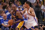 OKLAHOMA CITY, OK - MAY 16:  Kobe Bryant #24 of the Los Angeles Lakers looks to drive on Thabo Sefolosha #2 of the Oklahoma City Thunder in Game Two of the Western Conference Semifinals in the 2012 NBA Playoffs on May 16, 2012 at the Chesapeake Energy Arena in Oklahoma City, Oklahoma. The Thunder beat the Lakers 77-75.  NOTE TO USER: User expressly acknowledges and agrees that, by downloading and or using the photograph, User is consenting to the terms and conditions of the Getty Images License Agreement. (Photo by Brett Deering/Getty Images)