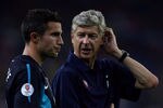 KUALA LUMPUR, MALAYSIA - JULY 13: Arsene Wenger, coach of Arsenal, speaks to Robin Van Persie on the touchline during the pre-season Asian Tour friendly match between Malaysia and Arsenal at Bukit Jalil National Stadium on July 13, 2011 in Kuala Lumpur, Malaysia.  (Photo by Stanley Chou/Getty Images)
