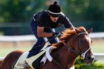 BALTIMORE, MD - MAY 17:  Exercise rider Jonny Garcia takes I'll Have Another over the track in preparation for the 137th Preakness Stakes at Pimlico Race Course on May 17, 2012 in Baltimore, Maryland.  (Photo by Rob Carr/Getty Images)