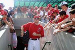 TEMPE, AZ - MARCH 10:  Mark Trumbo #44 of the Los Angeles Angels of Anaheim walks out onto the field past fans before the spring training game against the San Francisco Giants at Tempe Diablo Stadium on March 10, 2012 in Tempe, Arizona.  (Photo by Christian Petersen/Getty Images)
