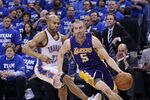 OKLAHOMA CITY, OK - MAY 16:  Steve Blake #5 of the Los Angeles Lakers drives around Derek Fisher #37 of the Oklahoma City Thunder in Game Two of the Western Conference Semifinals in the 2012 NBA Playoffs on May 16, 2012 at the Chesapeake Energy Arena in Oklahoma City, Oklahoma. The Thunder beat the Lakers 77-75.  NOTE TO USER: User expressly acknowledges and agrees that, by downloading and or using the photograph, User is consenting to the terms and conditions of the Getty Images License Agreement. (Photo by Brett Deering/Getty Images)