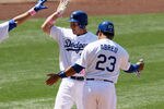LOS ANGELES, CA - MAY 13:  A.J. Ellis #17, James Loney #7, and Bobby Abreu #23 of the Los Angeles Dodgers celebrate after they score on Ellis' three run home run in the fifth inning against the Colorado Rockies on May 13, 2012 at Dodger Stadium in Los Angeles, California.  (Photo by Stephen Dunn/Getty Images)