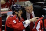 WASHINGTON, DC - NOVEMBER 29:  New head coach Dale Hunter of the Washington Capitals (R) talks with Alex Ovechkin #8 during the first period against the St. Louis Blues at Verizon Center on November 29, 2011 in Washington, DC.  (Photo by Rob Carr/Getty Images)