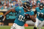 JACKSONVILLE, FL - JANUARY 01:  Tight end Marcedes Lewis #89  of the Jacksonville Jaguars runs upfield with a pass against the Indianapolis Colts January 1, 2012 at EverBank Field in Jacksonville, Florida.  (Photo by Al Messerschmidt/Getty Images)