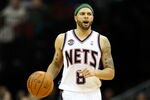 NEWARK, NJ - APRIL 10:  Deron Williams #8 of the New Jersey Nets brings the ball up court in the second half against the Philadelphia 76ers at Prudential Center on April 10, 2012 in Newark, New Jersey.  NOTE TO USER: User expressly acknowledges and agrees that, by downloading and or using this photograph, User is consenting to the terms and conditions of the Getty Images License Agreement.  (Photo by Chris Chambers/Getty Images)