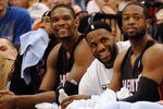 MINNEAPOLIS, MN - APRIL 1: Chris Bosh #1, LeBron James #6 and Dwyane Wade #3 of the Miami Heat sit on the bench in the final minutes of a basketball game against the Minnesota Timberwolves at Target Center on April 1, 2011 in Minneapolis, Minnesota. Heat defeated the Timberwolves 111- 92. NOTE TO USER: User expressly acknowledges and agrees that, by downloading and or using this Photograph, user is consenting to the terms and conditions of the Getty Images License Agreement.  (Photo by Hannah Foslien /Getty Images)