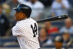 NEW YORK, NY - MAY 01:  Curtis Granderson #14 of the New York Yankees hits a home run  against the Baltimore Orioles during their game on May 1, 2012 at Yankee Stadium in the Bronx borough of New York City.  (Photo by Al Bello/Getty Images)