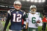 FOXBORO, MA - JANUARY 16:  Tom Brady #12 of the New England Patriots and Mark Sanchez #6 of the New York Jets walk off the field after the Jets defeated the Patriots 28 to 21 their 2011 AFC divisional playoff game at Gillette Stadium on January 16, 2011 in Foxboro, Massachusetts.  (Photo by Al Bello/Getty Images)