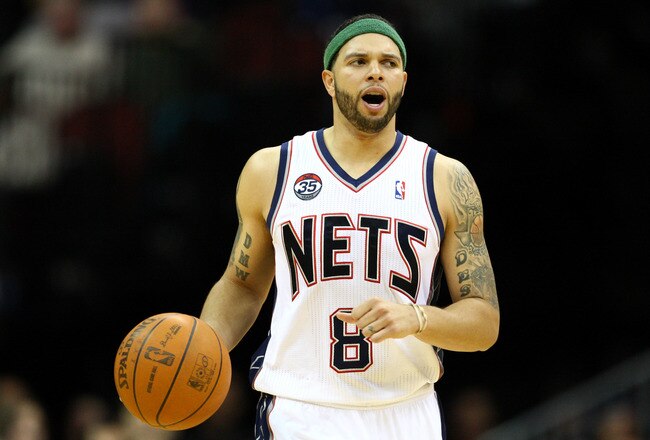 NEWARK, NJ - APRIL 10:  Deron Williams #8 of the New Jersey Nets brings the ball up court in the second half against the Philadelphia 76ers at Prudential Center on April 10, 2012 in Newark, New Jersey.  NOTE TO USER: User expressly acknowledges and agrees that, by downloading and or using this photograph, User is consenting to the terms and conditions of the Getty Images License Agreement.  (Photo by Chris Chambers/Getty Images)