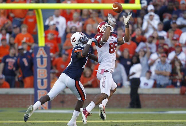AUBURN - OCTOBER 16:  Wide receiver Greg Childs #85 of the Arkansas Razorbacks catches a pass behind defensive back Neiko Thorpe #15 of the Auburn Tigers during the game at Jordan-Hare Stadium on October 16, 2010 in Auburn, Alabama.  The Tigers beat the Razorbacks 65-43.  (Photo by Mike Zarrilli/Getty Images)