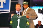 NEW YORK, NY - APRIL 26:  Nick Perry (R) from USC holds up a jersey as he stands on stage with NFL Commissioner Roger Goodell after he was selected #28 overall by the Green Bay Packers in the first round of the 2012 NFL Draft at Radio City Music Hall on April 26, 2012 in New York City.  (Photo by Al Bello/Getty Images)