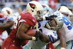 GLENDALE, AZ - DECEMBER 04:  Beanie Wells #26 of the Arizona Cardinals straight arms Anthony Spencer #93 of the Dallas Cowboys at University of Phoenix Stadium on December 4, 2011 in Glendale, Arizona.  (Photo by Norm Hall/Getty Images)
