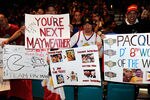 LAS VEGAS, NV - NOVEMBER 11:  Fans hold up signs before the start of the official weigh-in for the bout between Manny Pacquiao and Juan Manuel Marquez at the MGM Grand Garden Arena November 11, 2011 in Las Vegas, Nevada. Pacquiao will defend his WBO welterweight title against Marquez when the two meet in the ring for the third time on November 12 in Las Vegas.  (Photo by Ethan Miller/Getty Images)