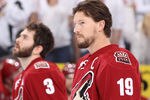 GLENDALE, AZ - MAY 15:  (R-L) Shane Doan #19 and Keith Yandle #3 of the Phoenix Coyotes stand attended for the National Anthem before Game Two of the Western Conference Finals during the 2012 NHL Stanley Cup Playoffs against the Los Angeles Kings at Jobing.com Arena on May 15, 2012 in Glendale, Arizona.  The Kings defeated the Coyotes 4-0.  (Photo by Christian Petersen/Getty Images)