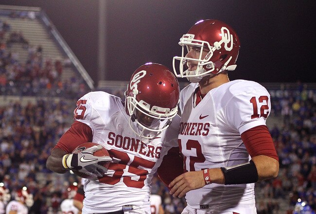 LAWRENCE, KS - OCTOBER 15:  Ryan Broyles #85 of the Oklahoma Sooners is congratulated by quarterback Landry Jones #12  after making a touchdown catch during the game against the Kansas Jayhawks on October 15, 2011 at Memorial Stadium in Lawrence, Kansas.  (Photo by Jamie Squire/Getty Images)